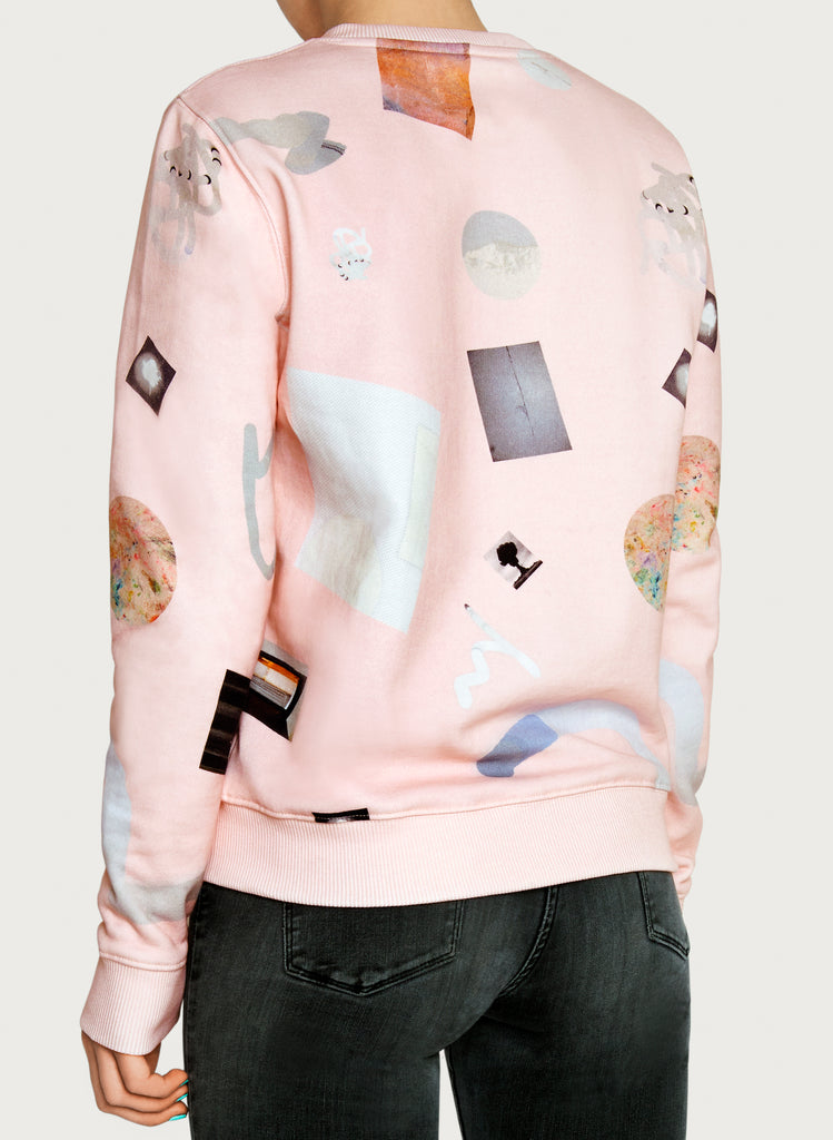 Woman with wearable art sweatshirt on. Pink-coloured hoodie, minimalistic design, made from sustainable material. Back picture.