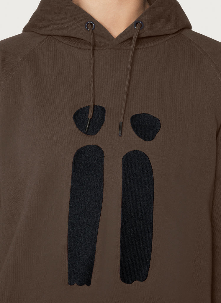 Zoomed in brown, unisex sweatshirt with ARTiiG logo on. Wearable art hoodie for him and her. Female version.